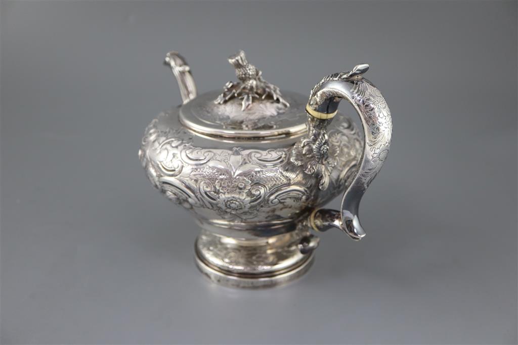 A George IV? silver pedestal teapot with thistle finial, marks rubbed,